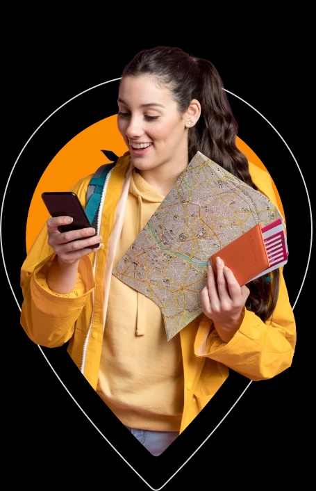 Girl with a map looking at the cell phone
